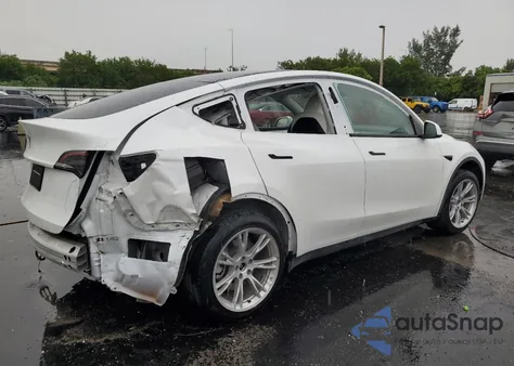 2023 Tesla Model Y from USA, damaged, VIN 7SAYGDED1PF962095